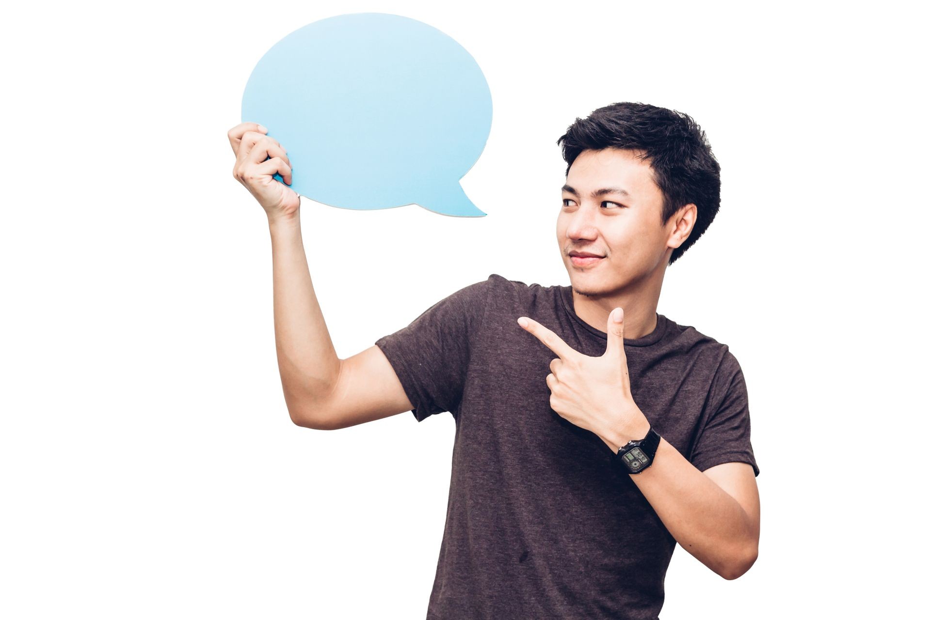 Young man holding up a speech bubble icon with copyspace